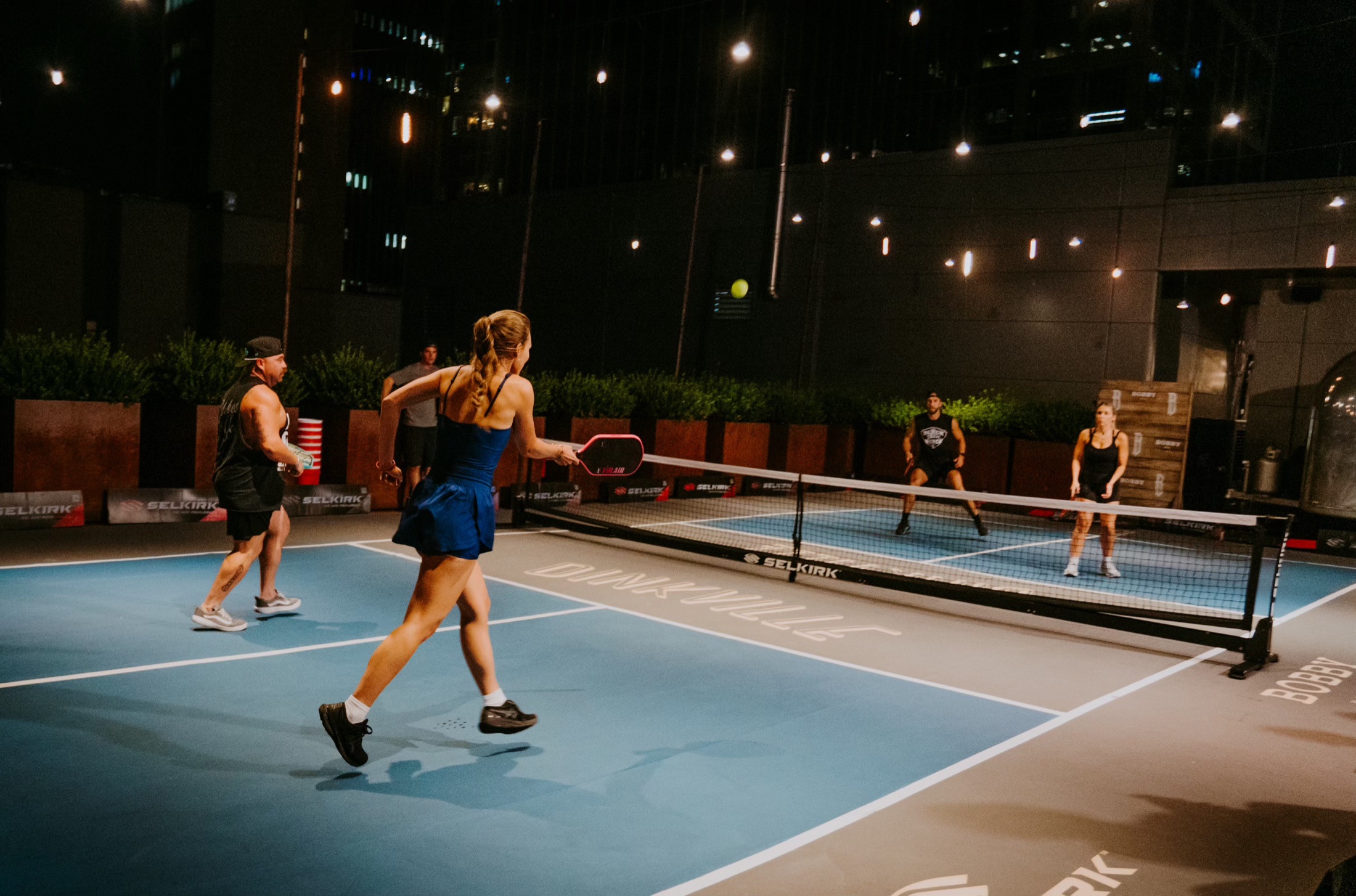 Players on the Dinkville court at Bobby Hotel