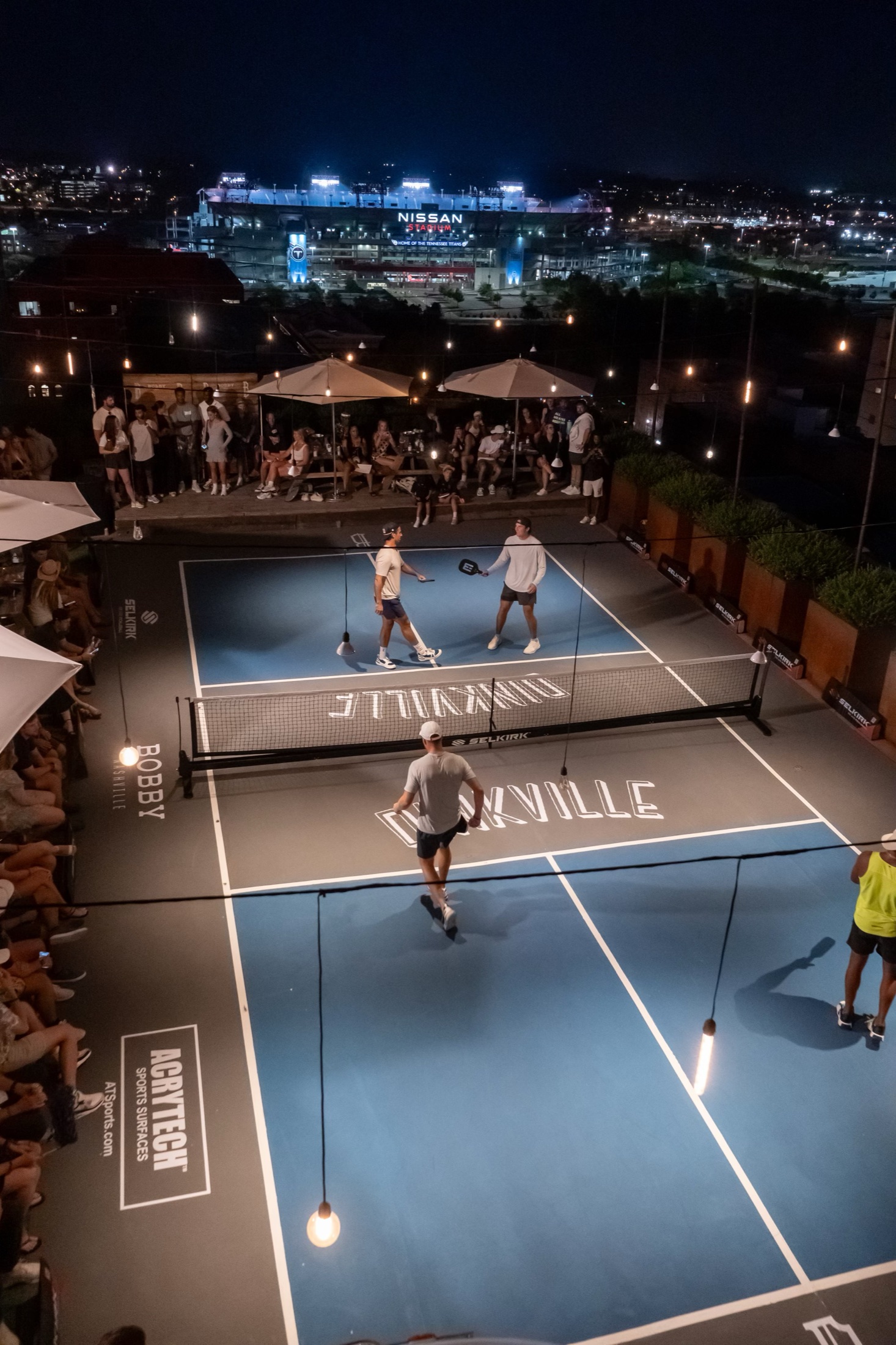 Dinkville pickleball on the Bobby Hotel rooftop overlooking Nashville